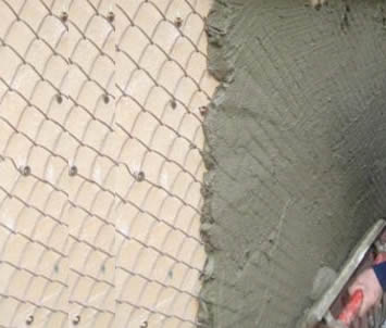 Chain link fence used as plastering mesh